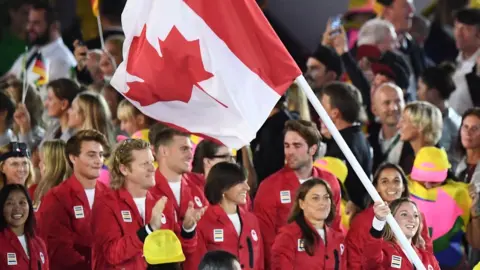 Getty Images Canada's flag bearer Rosannagh Maclennan leads her national delegation during the opening ceremony of the Rio 2016 Olympic Games at the Maracana stadium in Rio de Janeiro on August 5, 2016