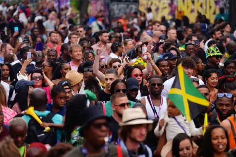 Victoria Jones/PA Wire Crowds at Notting Hill Carnival