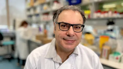 Martin Giles/BBC Prof Vassilios Vassiliou