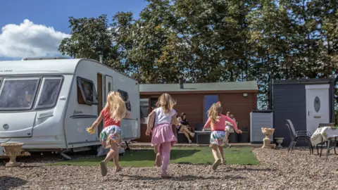 Three of the children running together