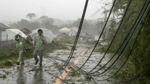 EPA A view of fallen electric cables after a tornado caused by Typhoon Hagibis hit Ichihara, Chiba Prefecture, 12 October 2019.