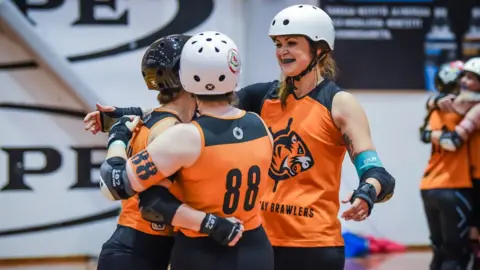 Paul Jones Captain Kid embraces team mates following a victory at the European Continental Cup