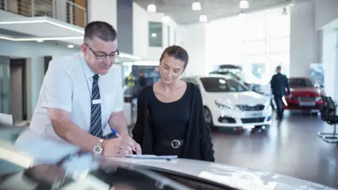 Getty Images A car showroom in US