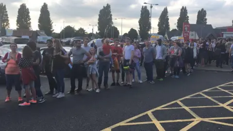 fans queue to enter the women's Champions League final game in Cardiff