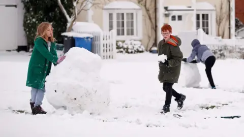 AFP Children playing in the snow in Hartley Wintney