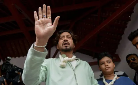 Getty Images Indian actor Irrfan Khan speaks to the media next to his son Aayan at the Mahatma Gandhi Ashram in Ahmedabad on June 19, 2016, on Father's Day.