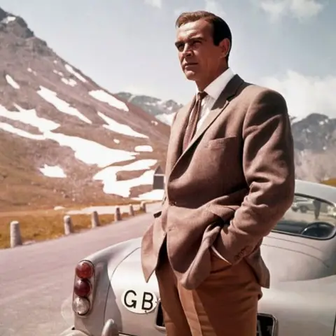 Getty Images Goldfinger still - Bond with Aston Martin