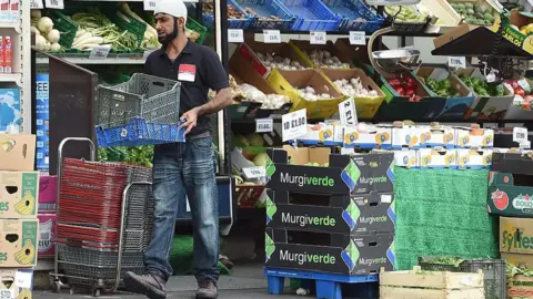 Getty Images Supermarket worker