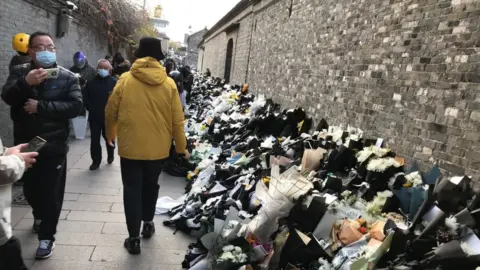 AFP flowers outside Jiang's home in Yanzhou