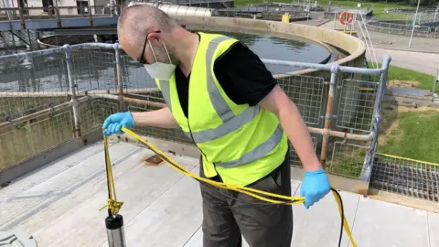 BBC Man testing wastewater