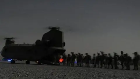 AFP US and Afghan security forces board a Chinook helicopter in Kandahar province southern Afghanistan - 14 August 2011