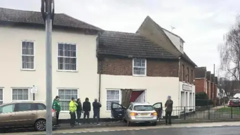 Chris Gadd A photo from the scene shows the car crashed into the property