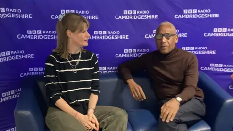 Kate Palmer/BBC Man and woman sitting on chair