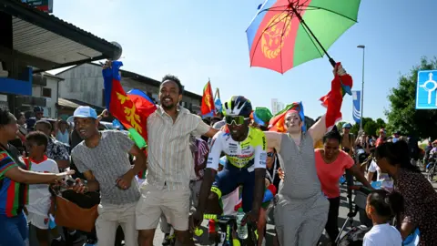 Dario Belingheri/Getty Images Cyclist Biniam Girmay of Eritrea and Team Intermarché-Circus-Wanty reacts after winning stage two of the 86th Tour de Suisse 2023, Nottwil, Switzerland - Monday 12 June 2023