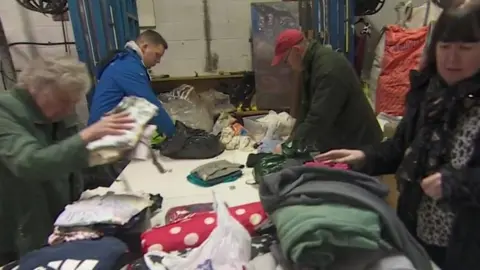 Volunteers packing clothes