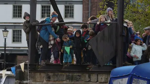 BBC People stand to see Little Amal