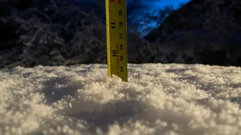 tape measure in snow