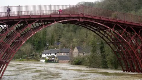 Getty Images Homes are flooded on the banks of the River Seven