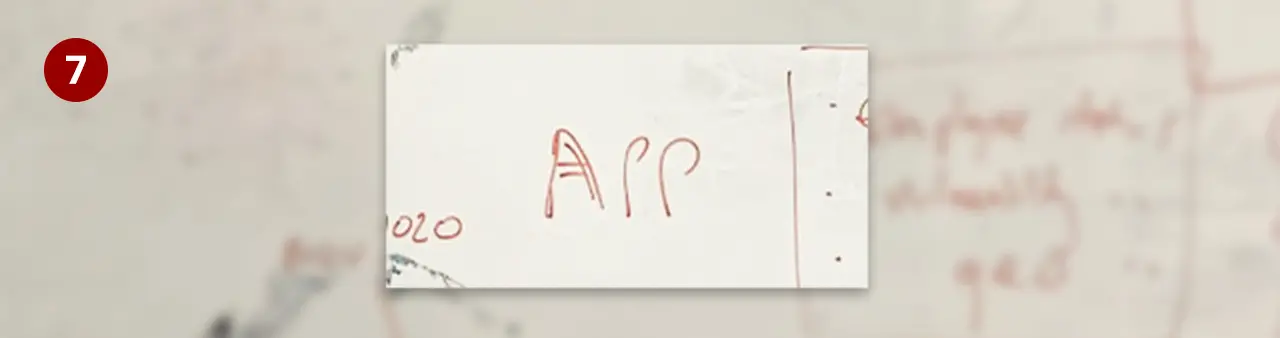 Whiteboard excerpt - the word 'APP' written in the middle of the board