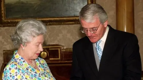 PA Media The Queen and John Major