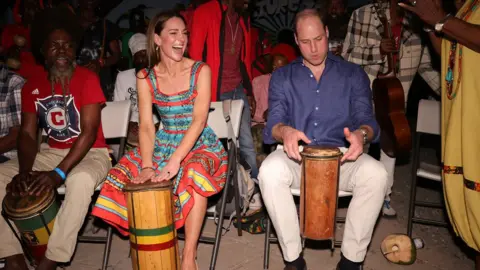 PA Media The Duchess and Duke of Cambridge play drums with Reggae musicians