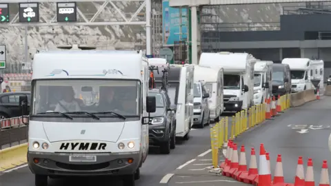 PA Media Camper vans leaving Dover port on Friday 14 August 2020, after arriving from France