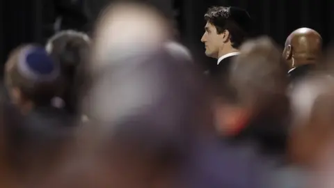 Reuters Canadian Prime Minister attending the memorial service for Barry and Honey Sherman