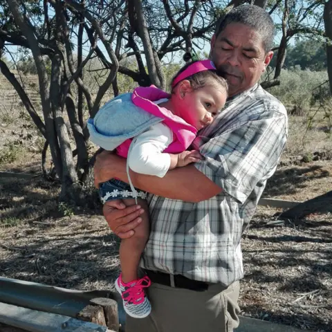 Michael with Miché's daughter