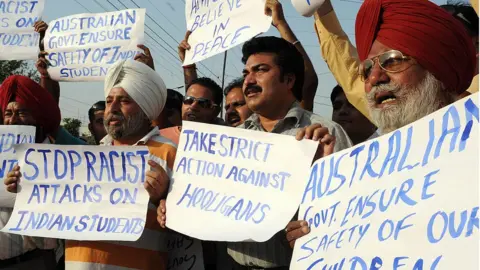 Getty Images Indian relatives of students in Australia and All Indian Human Rights Association members protest in Amritsar over racist attacks on Indian students in Australia, 29 May 2009