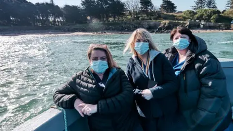 Hywel Dda UHB Surgery staff visited the 'rock' on Wednesday armed with the Oxford-AstraZeneca vaccine