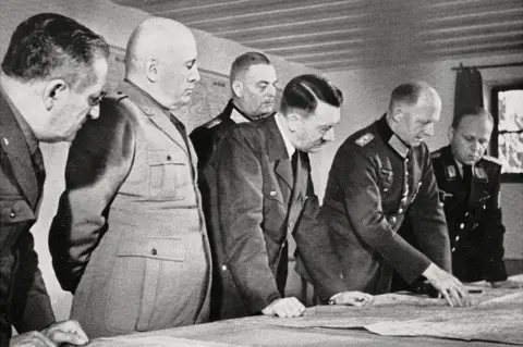 Getty Images Wolf's Lair, August 1941: Hitler (C) and Mussolini (2nd L)