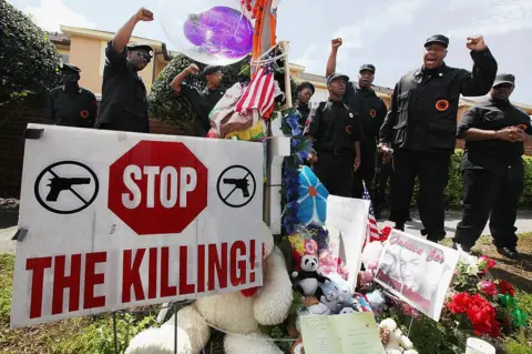 Getty Images Members of the New Black Panther Party rally at a Florida memorial to Trayvon Martin