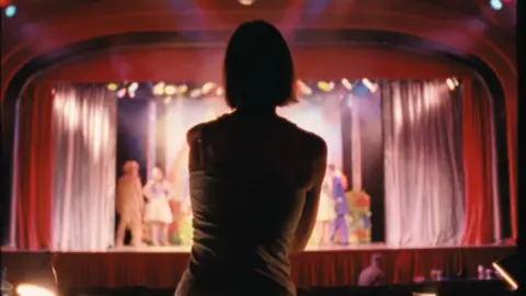 Seaside Special Di Cooke in front of the stage