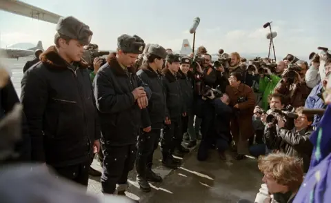 AFP/Getty Images Red Army soldiers surrounded by foreign press wait at Kabul airport in February 1989, during the Soviet Army's withdrawal from Afghanistan.