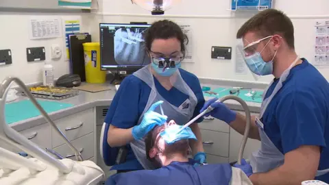 BBC student dentists with patient