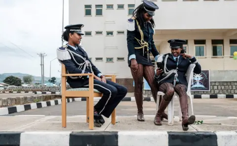AFP Female members of a brass band chat and rest before the inauguration of the Tibebe Ghion Specialised Hospital in Bahir Dar, Ethiopia - Saturday 10 November 2018