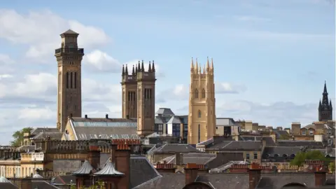 Getty Images Located in the West End of Glasgow, the Trinity College Towers and Park Church stand out from the urban scene on a clear day.