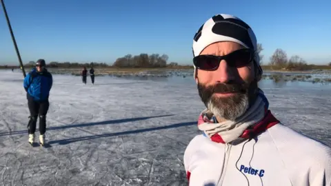 John Devine/BBC Peter Carr on the ice at Upware