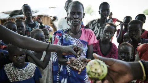 Christina Simons Mary Nyantey (centre) in a camp for displaced people in Bentiu, South Sudan