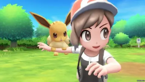 Nintendo Eevee on shoulder of Pokemon trainer