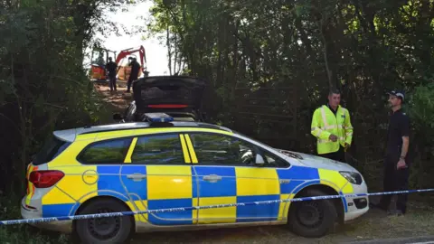 PA Media Police officers search for Suzy Lamplugh in an area near Pershore in Worcestershire