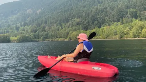 Brain Tumour Research Ms Wingfield on a canoe in Canada