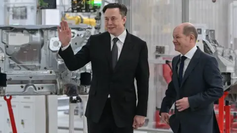 Getty Images Elon Musk and German Chancellor Olaf Scholz