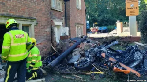 Trowbridge Fire Station A car in rubble