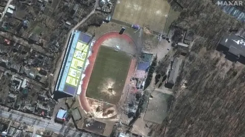 Maxar Technologies via Reuters A satellite image shows a damaged Olympic sports training centre, in Chernihiv, on 16 March