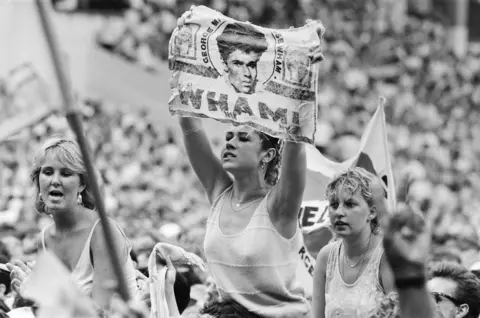 Alamy Fans attend Wham!'s final gig