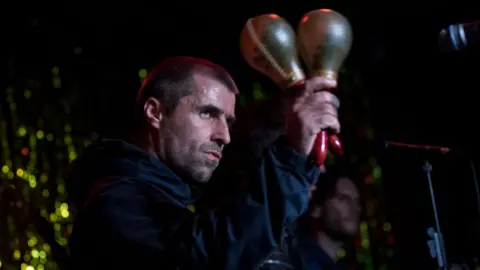 Getty Images Liam Gallagher performing on stage