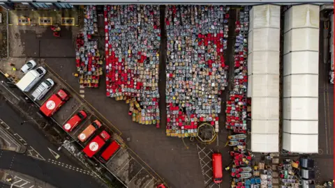 Ben Birchall/PA Parcels outside Royal Mail centre in Bristol