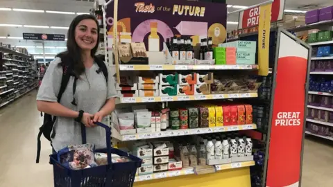 BBC Andi Naude stands next to the new range