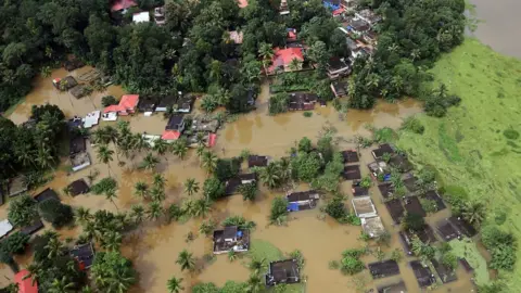 Reuters Aerial view of partially submerged houses